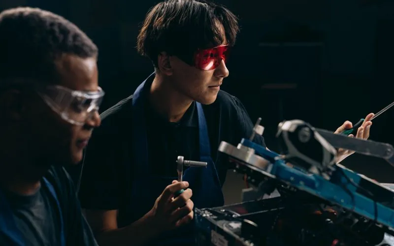 Research and development — engineer working on industrial machine